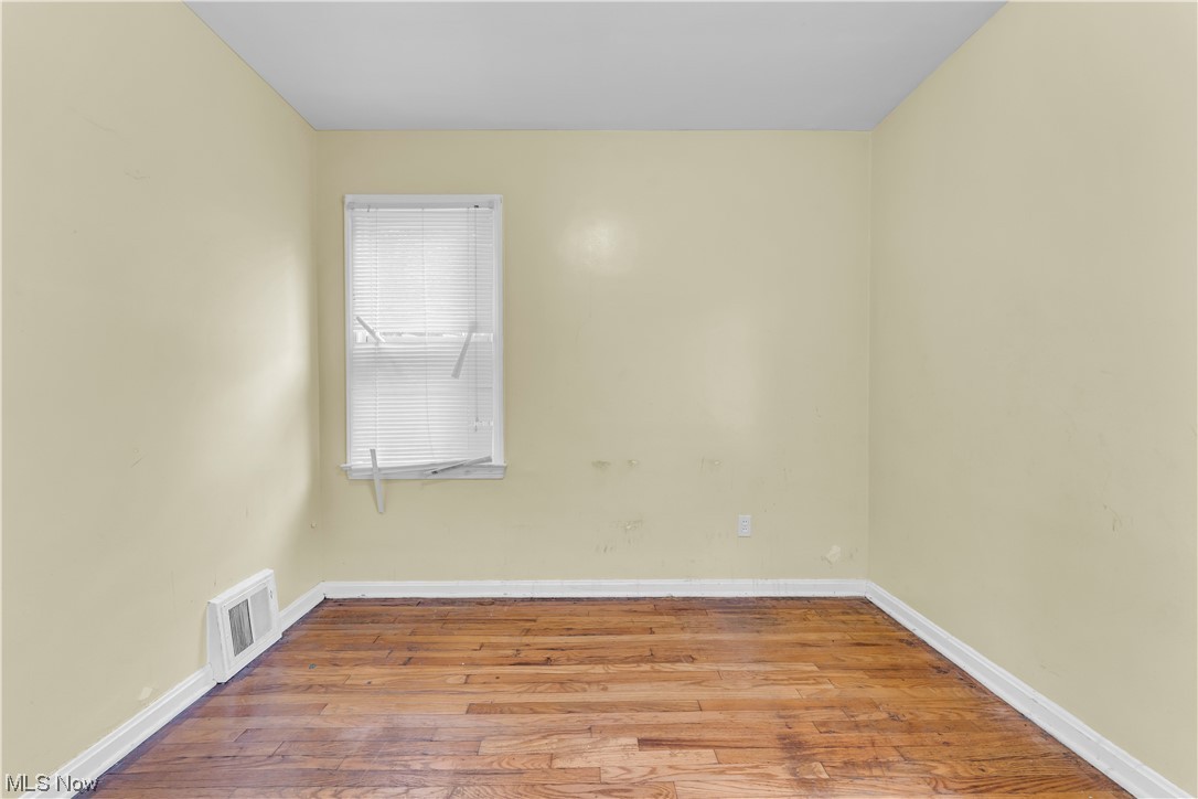 5619 Dunham Road Maple Heights, OH 44137 - Photo 9 of 19 View of hardwood floored empty room