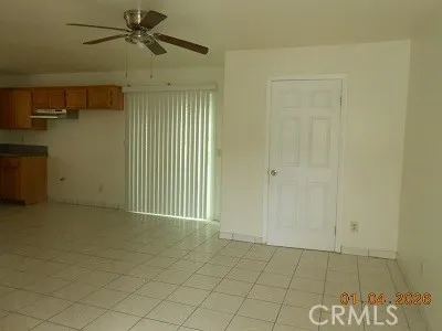 an empty room with a empty space and windows