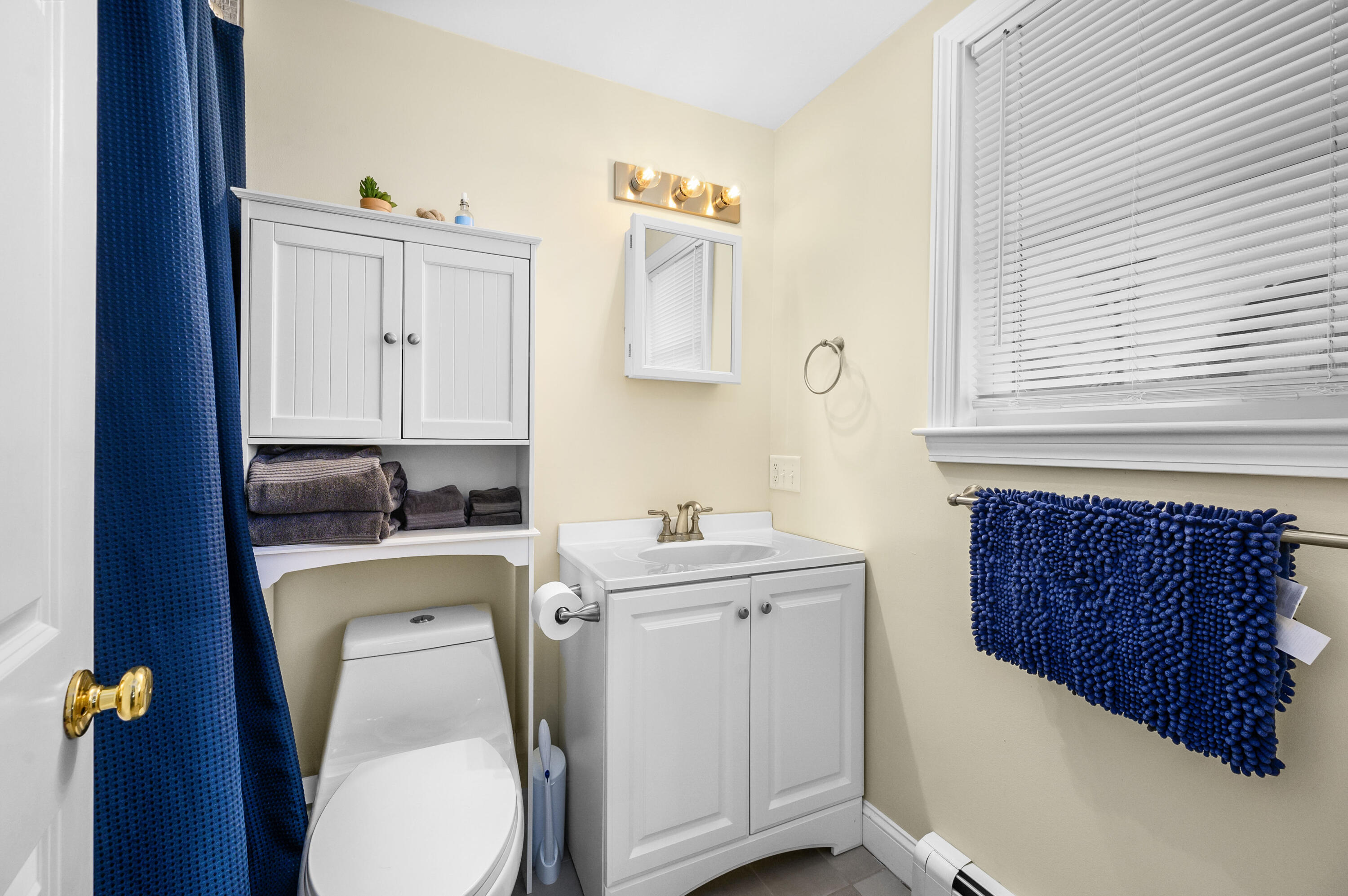 70 High School Road Hyannis, MA 02601 - Photo 18 of 23 a bathroom with a sink a toilet and mirror