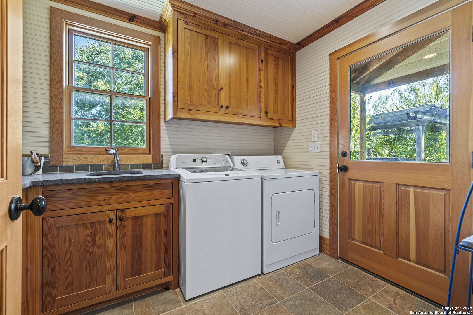 9402 Doss-Spring Creek Road Doss, TX 78618 - Photo 11 of 42 a utility room with dryer and washer