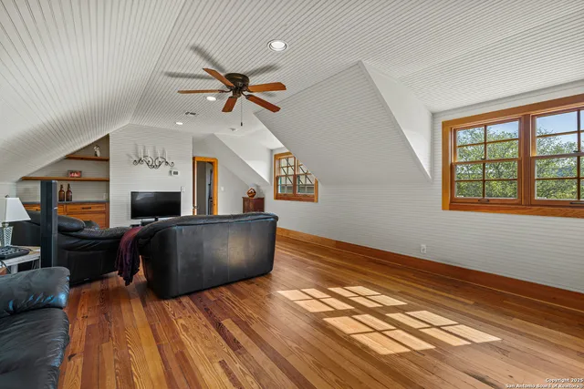 a view of living room with furniture and a window