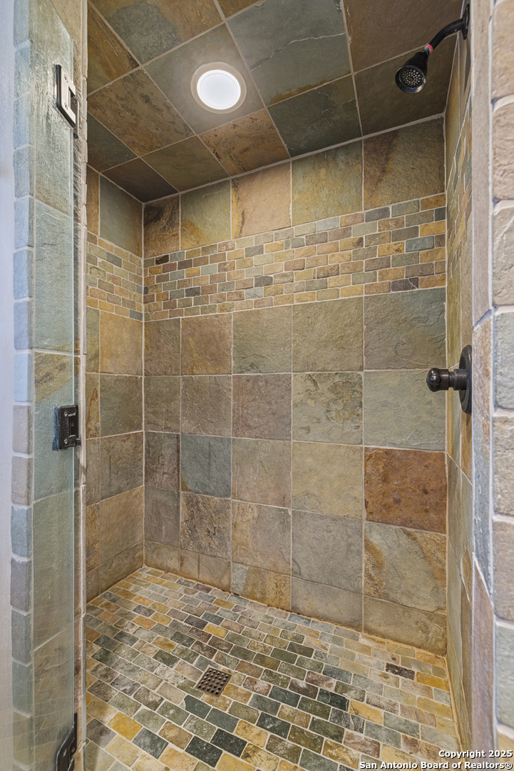9402 Doss-Spring Creek Road Doss, TX 78618 - Photo 19 of 42 a bathroom with a shower