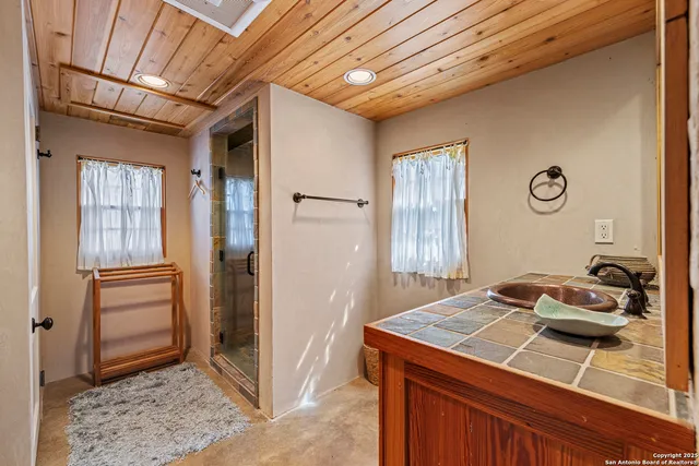a view of a chairs and table in the balcony