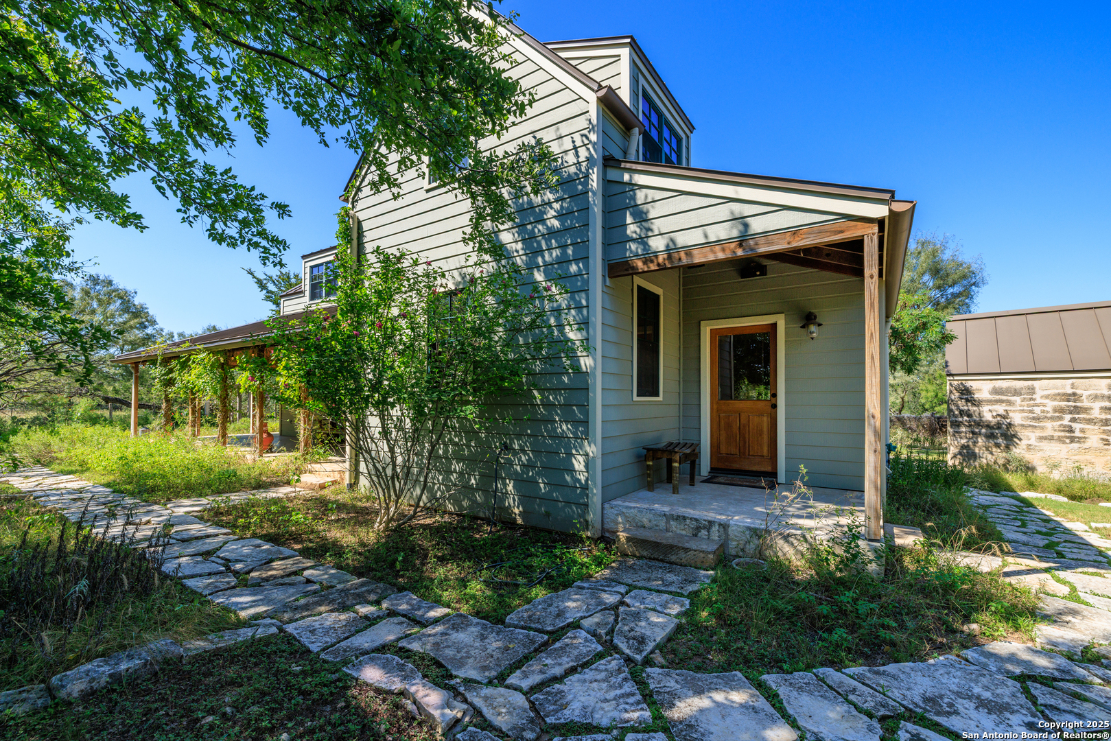 9402 Doss-Spring Creek Road Doss, TX 78618 - Photo 25 of 42 a view of a house with a yard