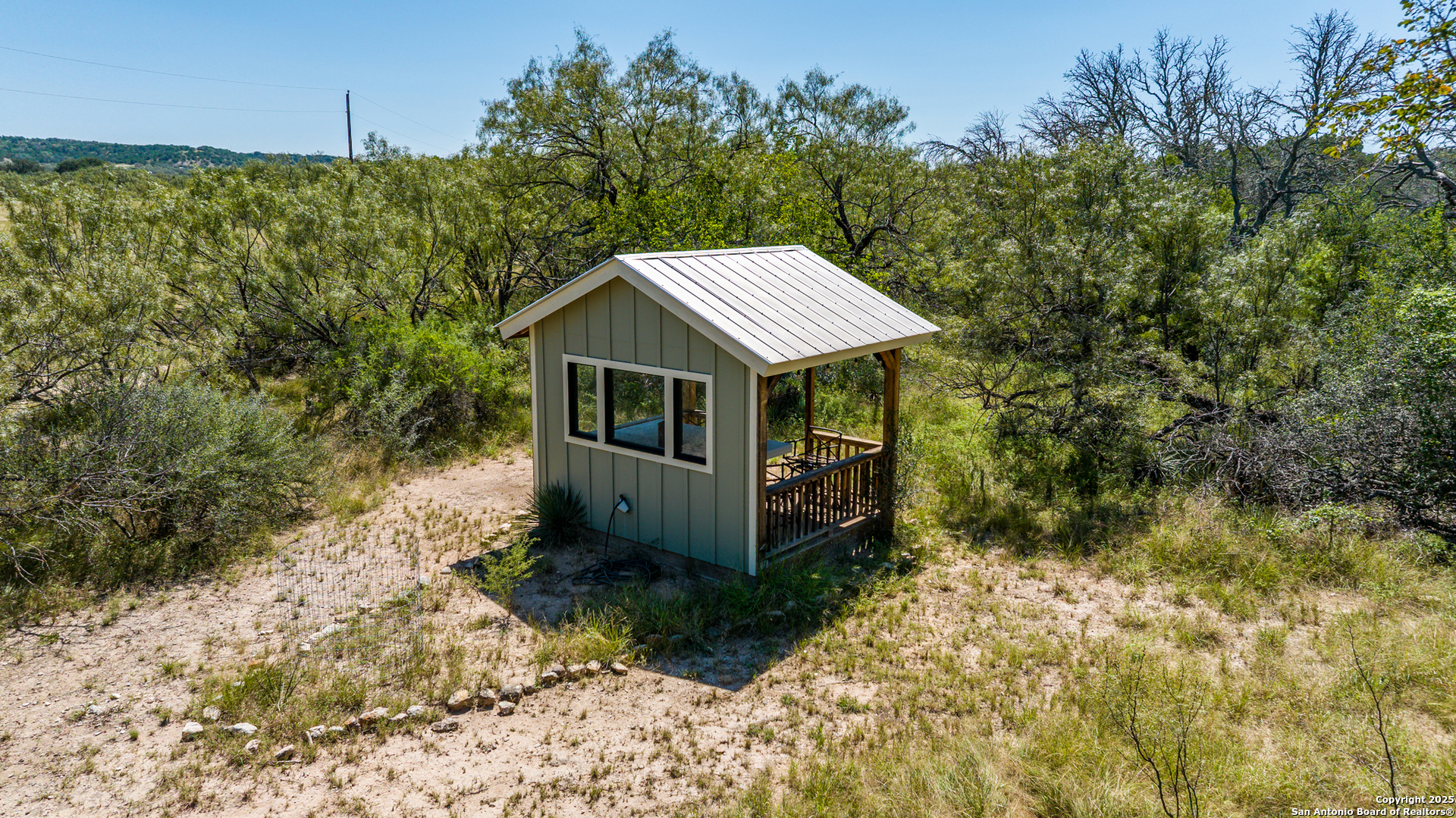 9402 Doss-Spring Creek Road Doss, TX 78618 - Photo 27 of 42 a view of a house with a yard