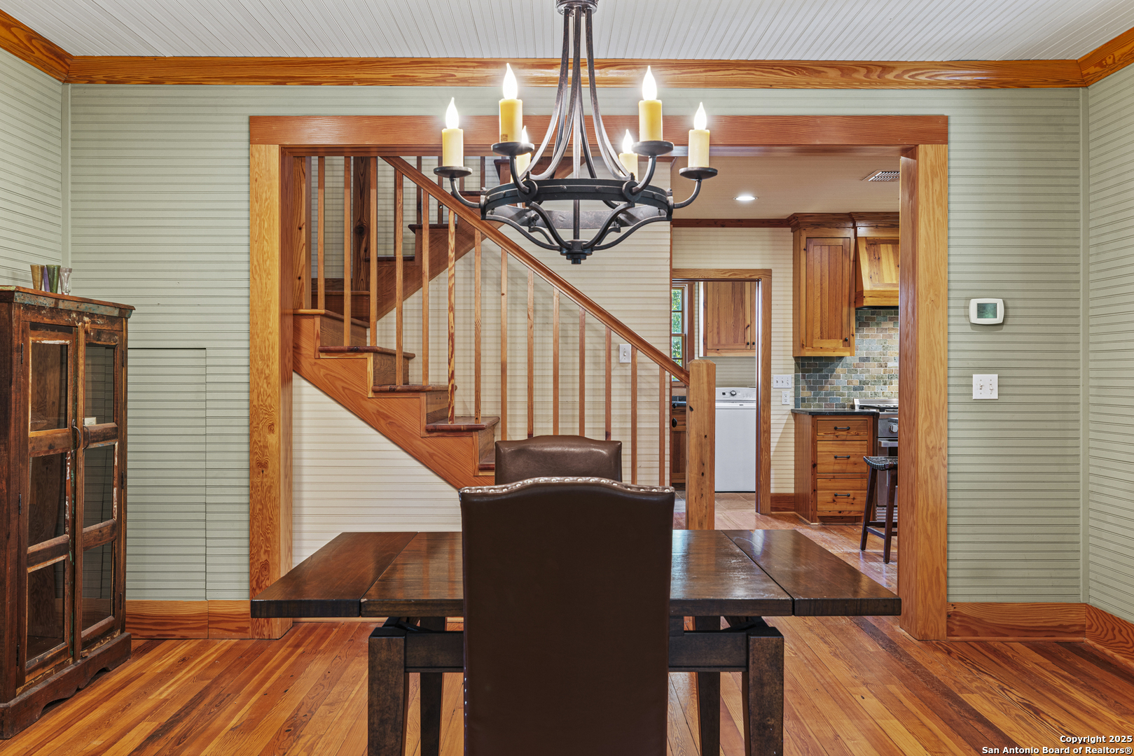 9402 Doss-Spring Creek Road Doss, TX 78618 - Photo 7 of 42 a view of a dining room with furniture window and wooden floor