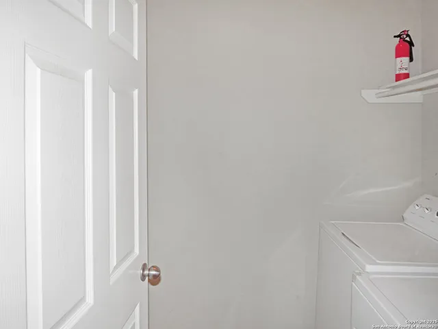 a white toilet sitting next to a shower