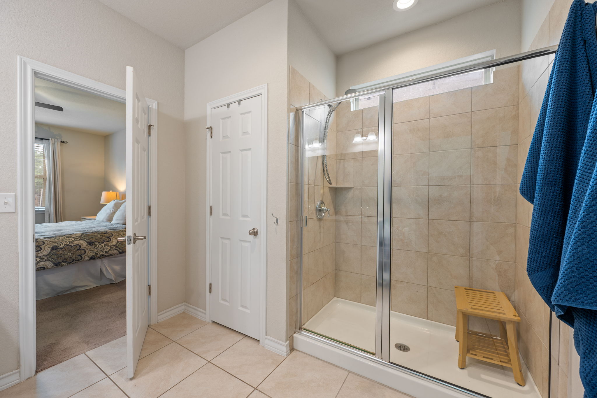 409 Limestone Road Liberty Hill, TX 78642 - Photo 18 of 35 a bathroom with a glass shower door