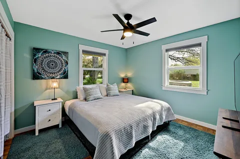 a bedroom with a bed and a window