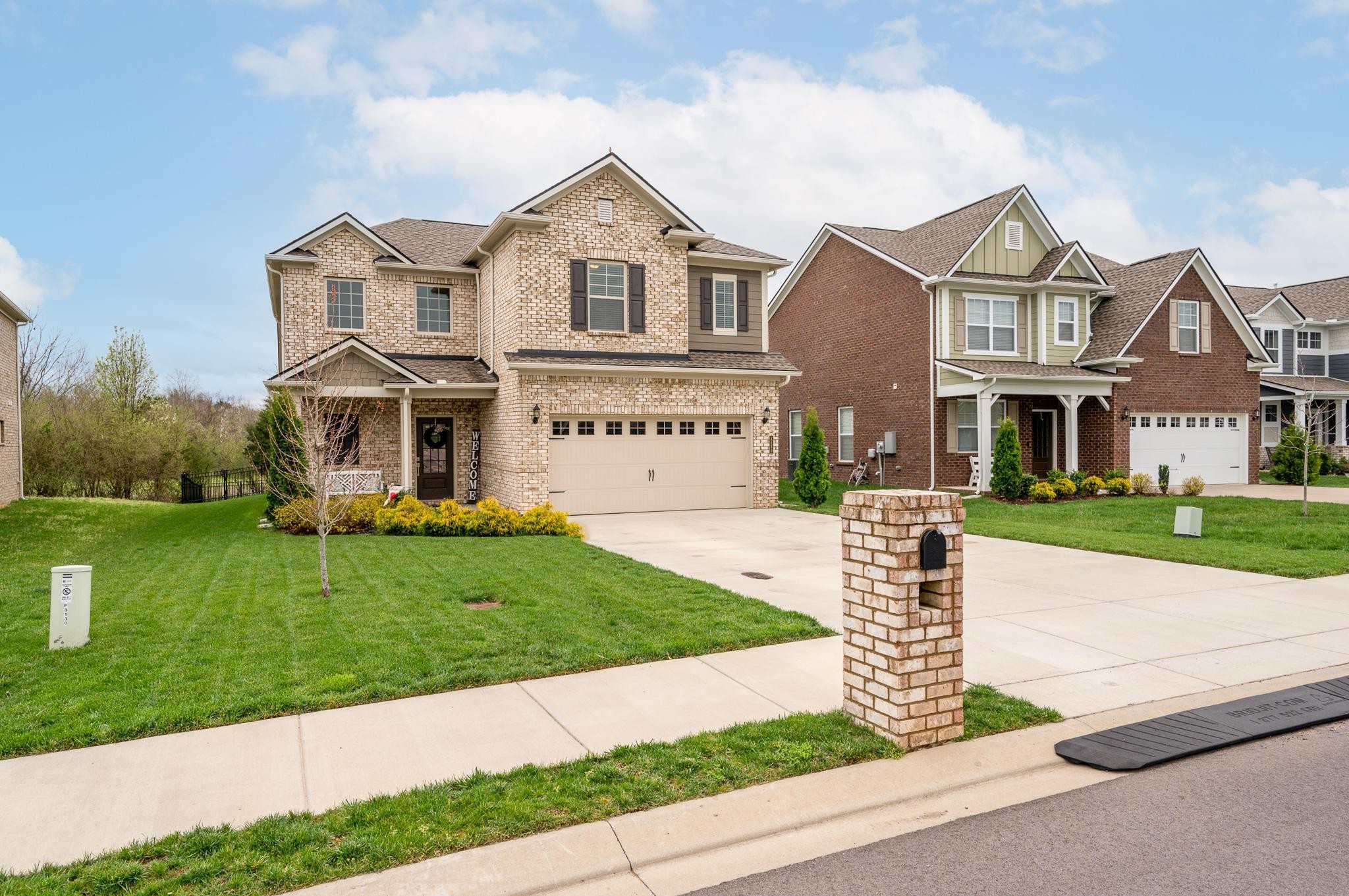 3130 Rift Lane Murfreesboro, TN 37130 - Photo 29 of 31 a front view of a house with a yard and garage
