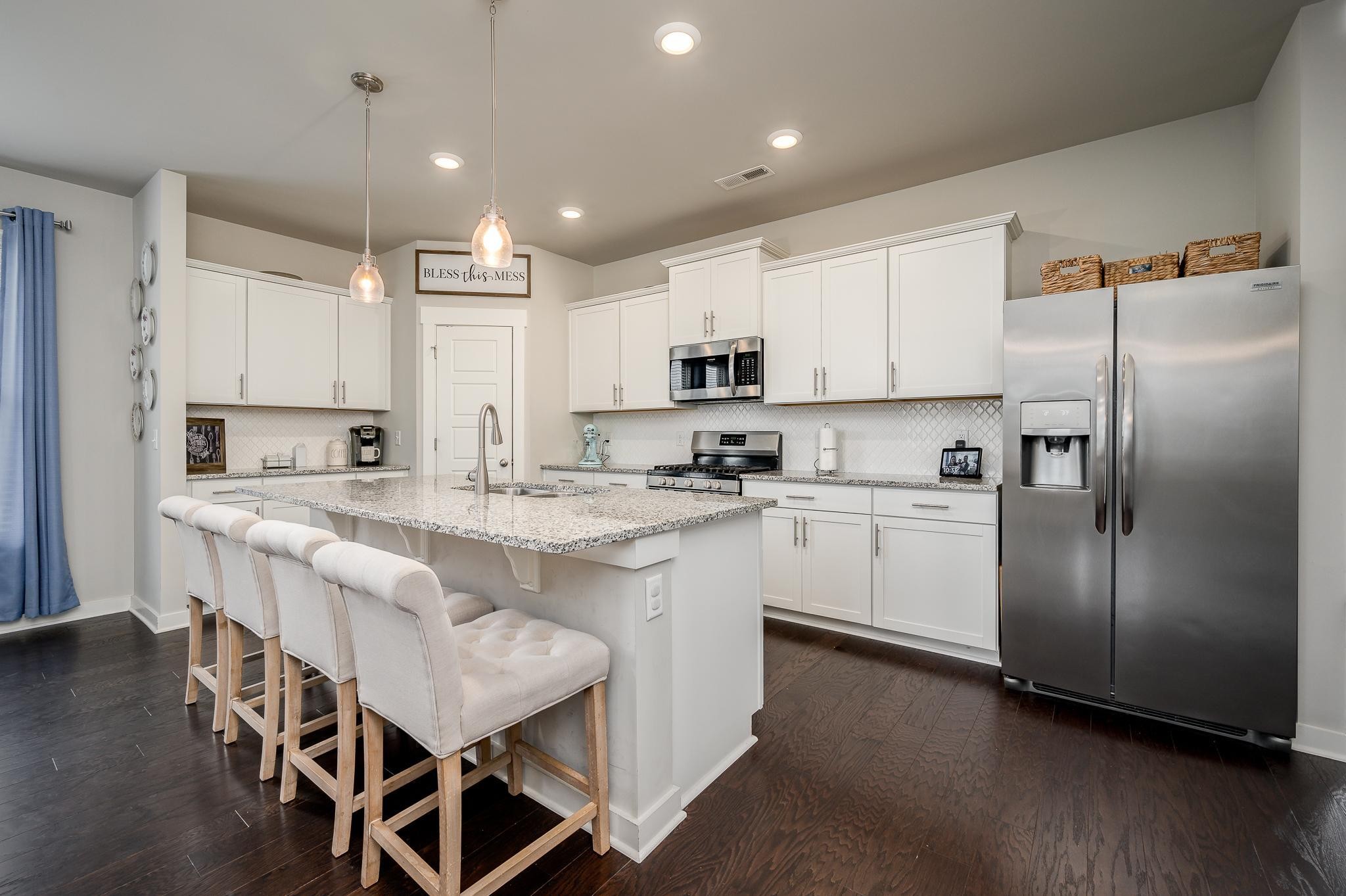 3130 Rift Lane Murfreesboro, TN 37130 - Photo 3 of 31 a kitchen with stainless steel appliances granite countertop a white cabinets and a refrigerator