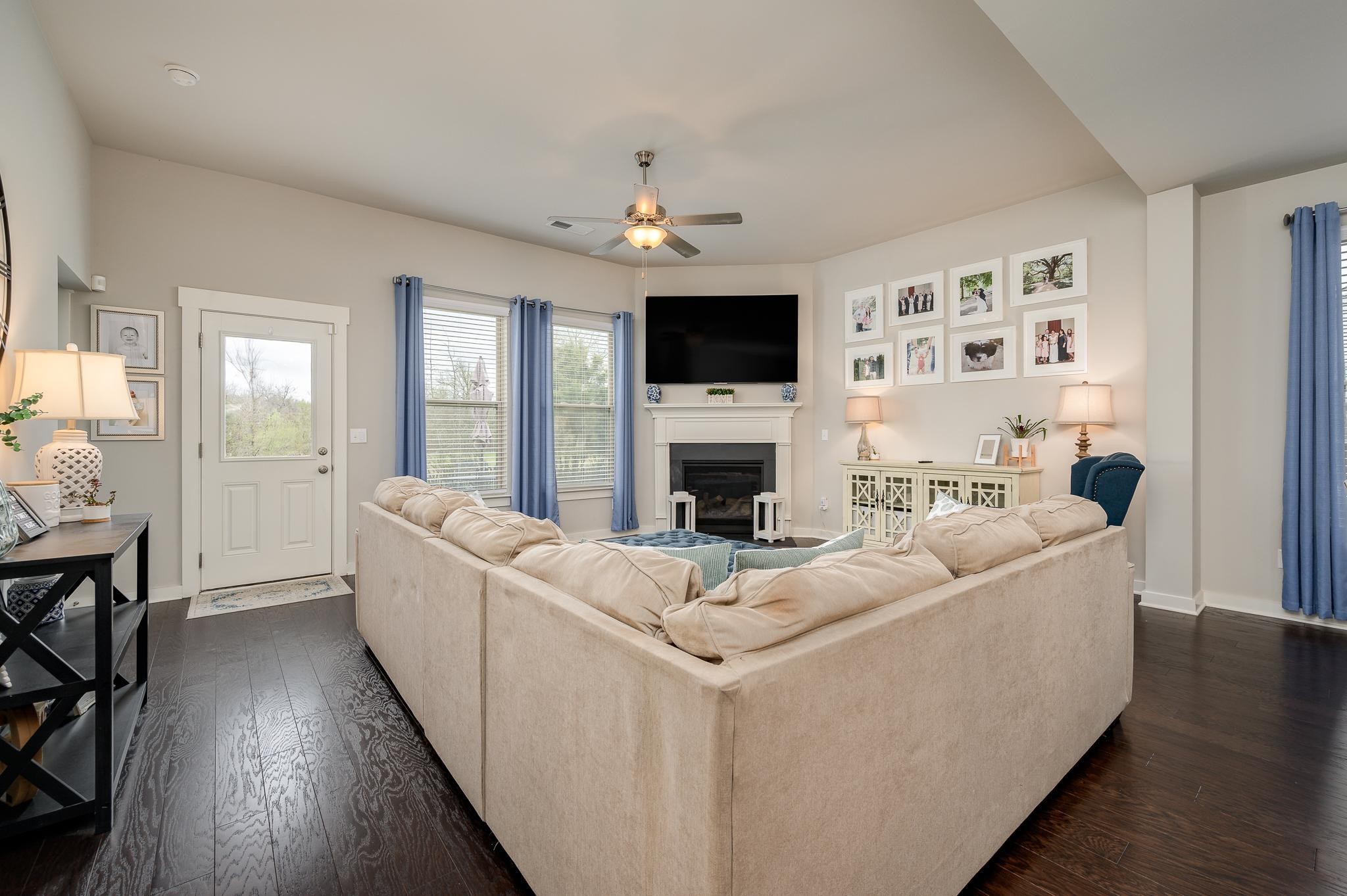3130 Rift Lane Murfreesboro, TN 37130 - Photo 4 of 31 a living room with furniture a fireplace and a flat screen tv