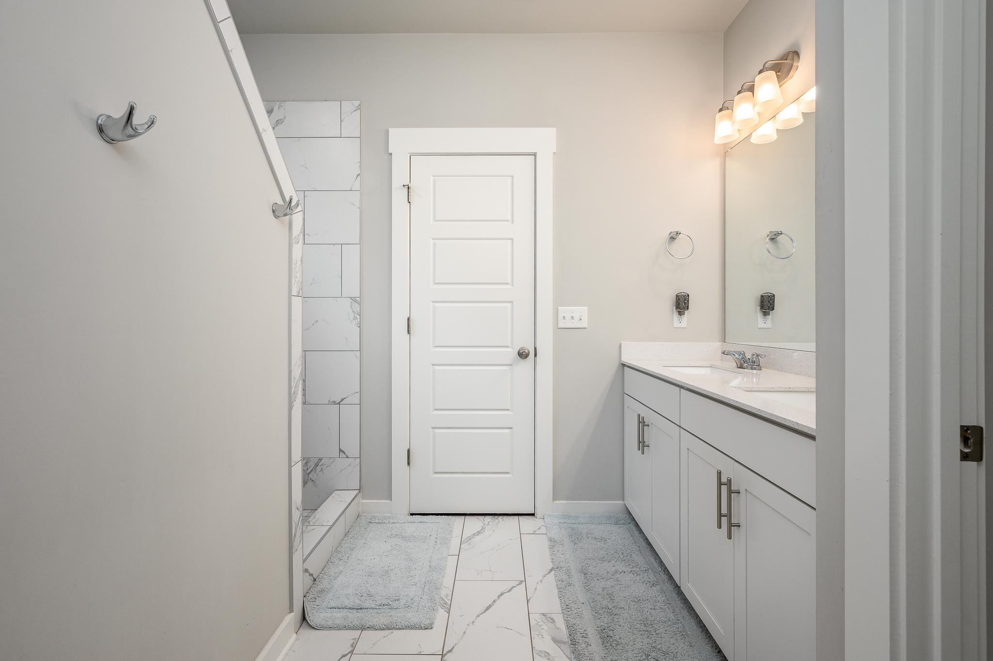 3130 Rift Lane Murfreesboro, TN 37130 - Photo 9 of 31 a bathroom with a granite countertop sink a toilet and shower
