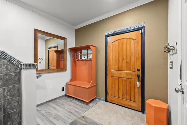 a room with a door and wooden floor