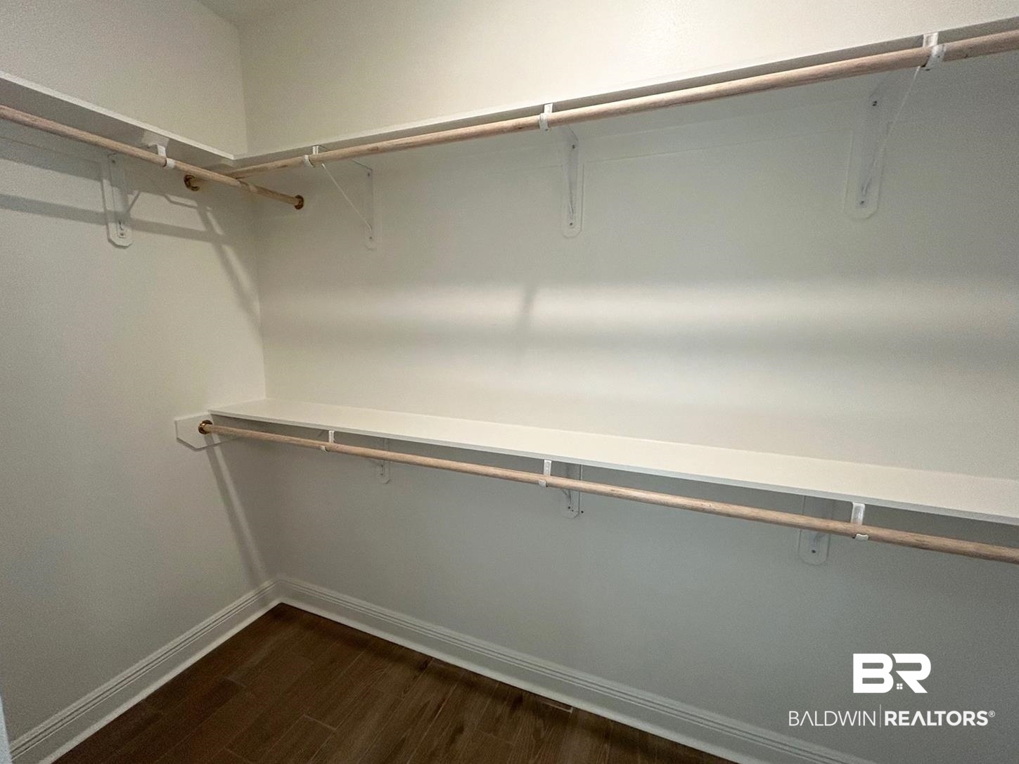 884 Sumter Loop Foley, AL 36535 - Photo 10 of 18 Walk in closet featuring dark hardwood / wood-style flooring