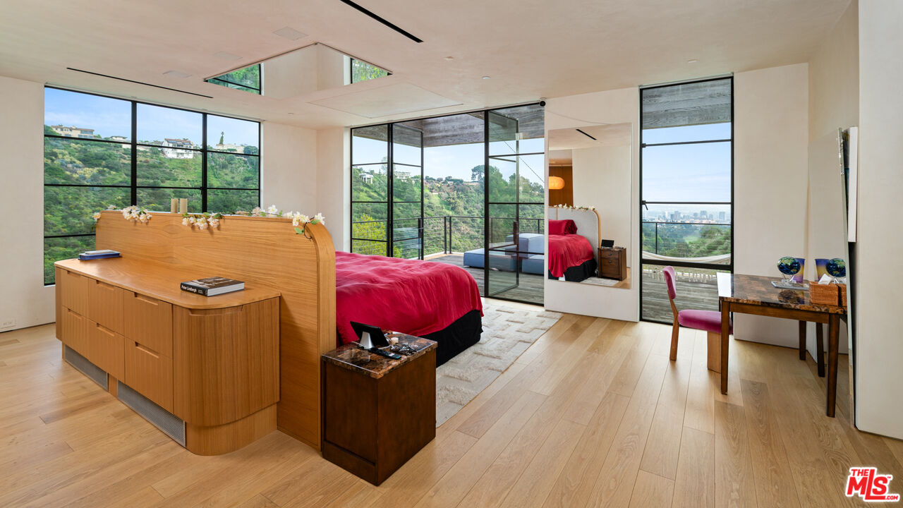 11531 Orum Road Los Angeles, CA 90049 - Photo 12 of 27 a living room with furniture and a floor to ceiling window