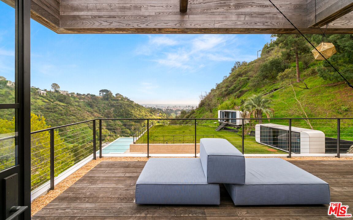 11531 Orum Road Los Angeles, CA 90049 - Photo 15 of 27 a view of sitting space with swimming pool