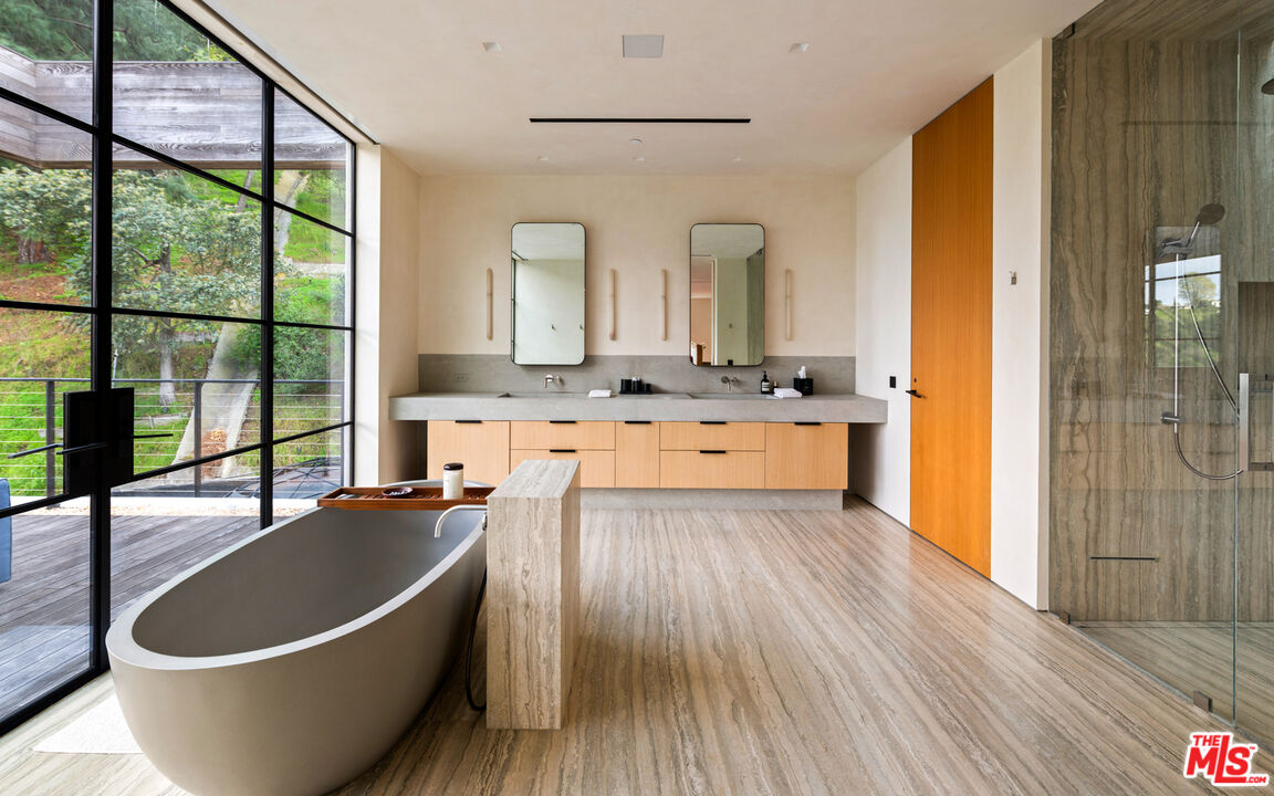 11531 Orum Road Los Angeles, CA 90049 - Photo 16 of 27 a large white kitchen with wooden floors