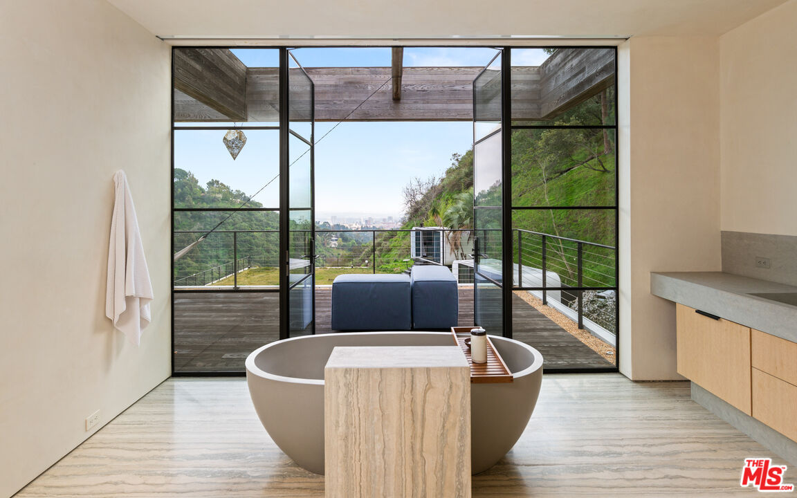 11531 Orum Road Los Angeles, CA 90049 - Photo 17 of 27 a living room with hardwood floor and a balcony