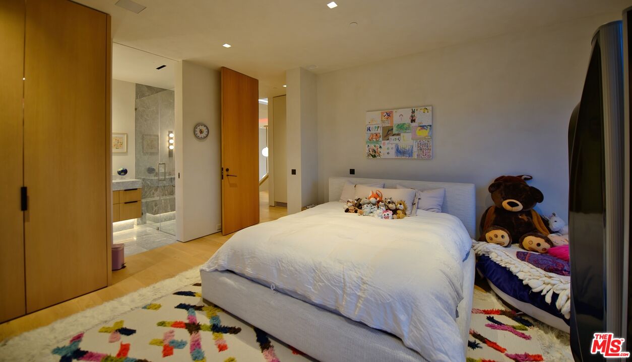 11531 Orum Road Los Angeles, CA 90049 - Photo 20 of 27 a bedroom with a bed and a dresser