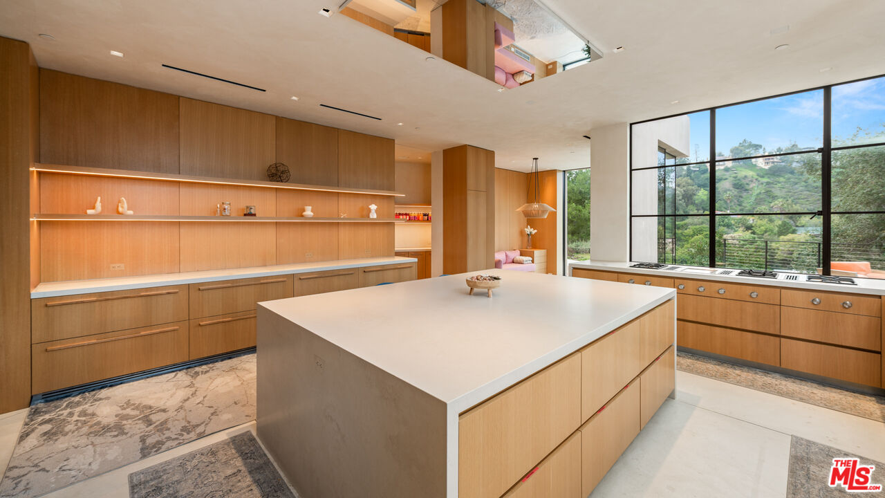 11531 Orum Road Los Angeles, CA 90049 - Photo 8 of 27 a room with storage and utility