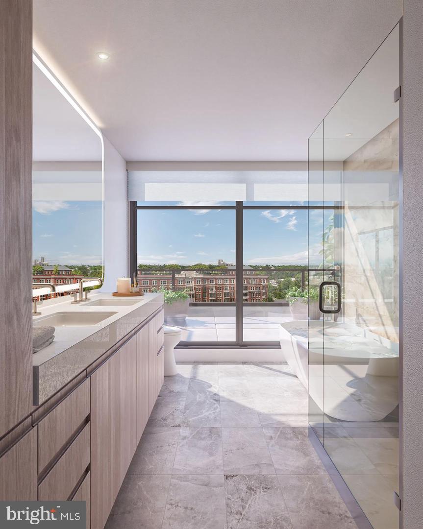 2601 Calvert Street Northwest, Unit 1706 Washington, DC 20008 - Photo 23 of 33 a bathroom with a large tub and sink