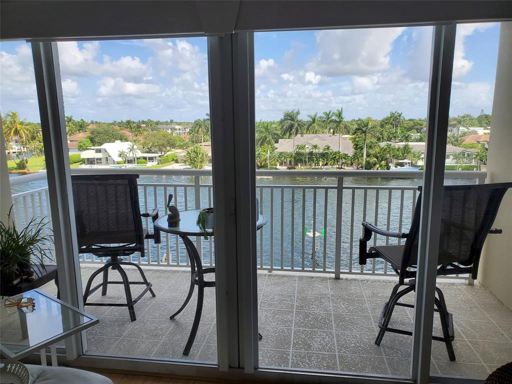 2611 North Riverside Drive, Unit 504 Pompano Beach, FL 33062 - Photo 12 of 35 a view of a room with furniture and floor to ceiling windows