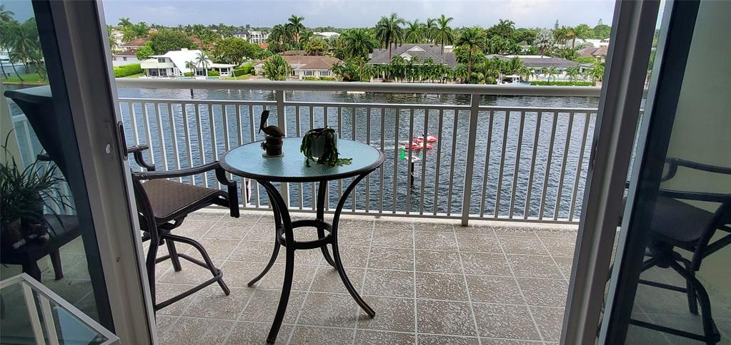 2611 North Riverside Drive, Unit 504 Pompano Beach, FL 33062 - Photo 14 of 35 a view of a balcony with chairs