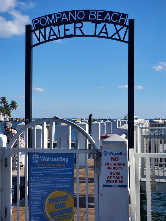 2611 North Riverside Drive, Unit 504 Pompano Beach, FL 33062 - Photo 33 of 35 a front view of a house with entryway