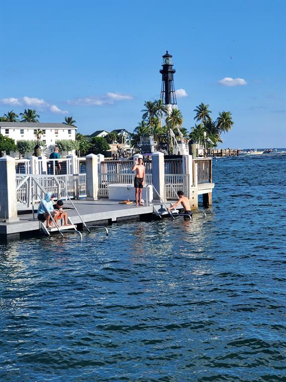 2611 North Riverside Drive, Unit 504 Pompano Beach, FL 33062 - Photo 34 of 35 a view of a house with a yard