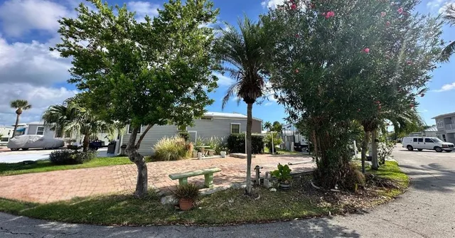 a tree in the garden of a building