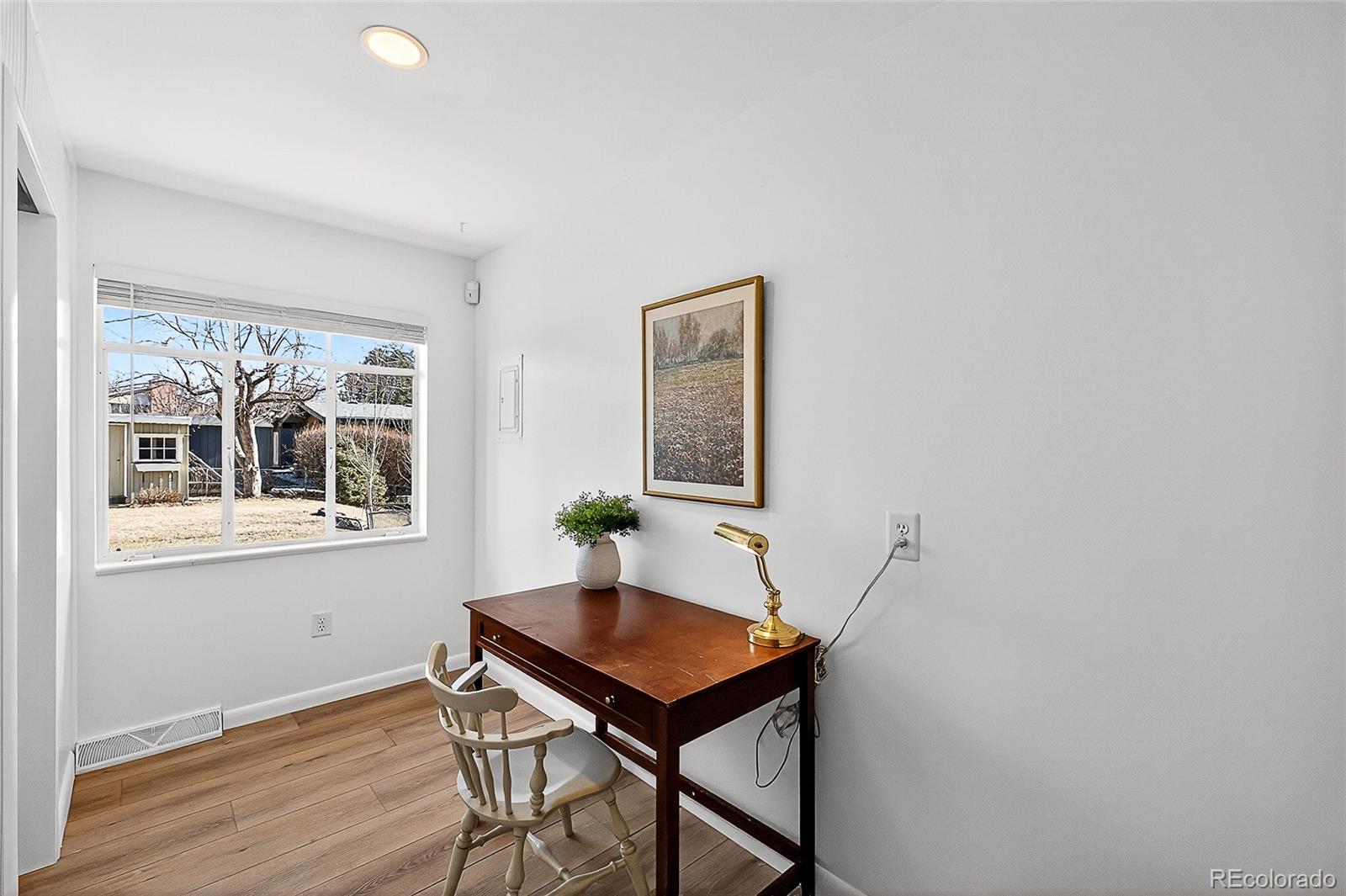 2768 South Mabry Way Denver, CO 80236 - Photo 14 of 39 a house that has a table and chair