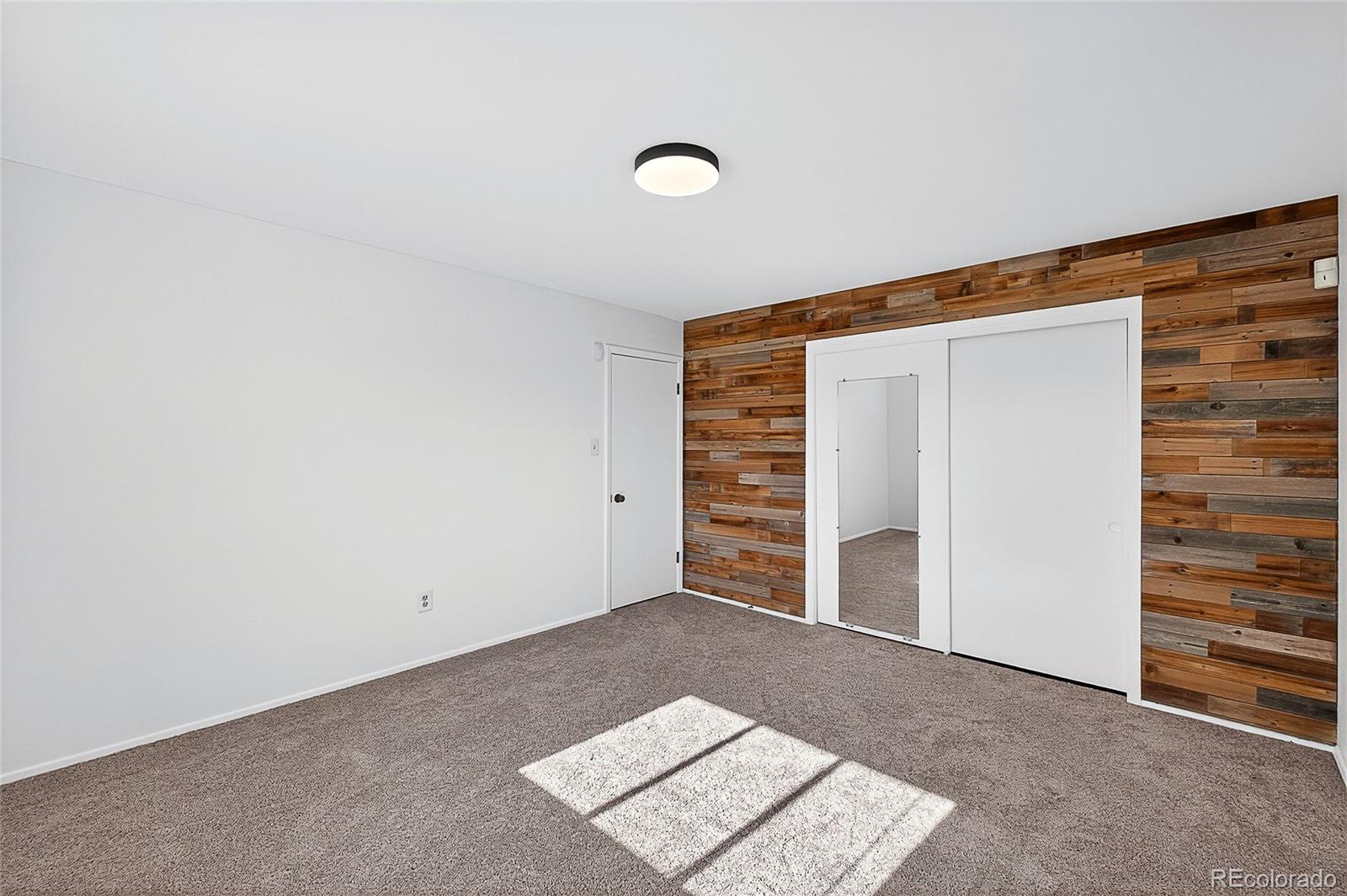 2768 South Mabry Way Denver, CO 80236 - Photo 22 of 39 a view of an empty room and fire place