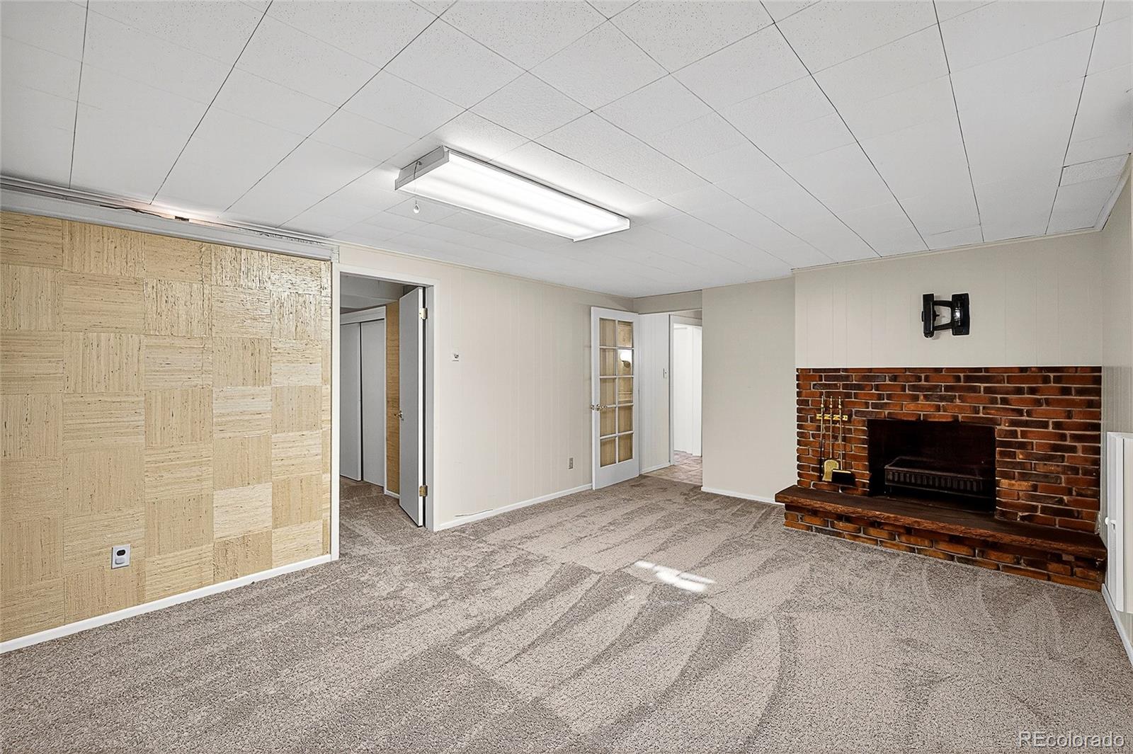 2768 South Mabry Way Denver, CO 80236 - Photo 27 of 39 a view of an empty room with a fireplace