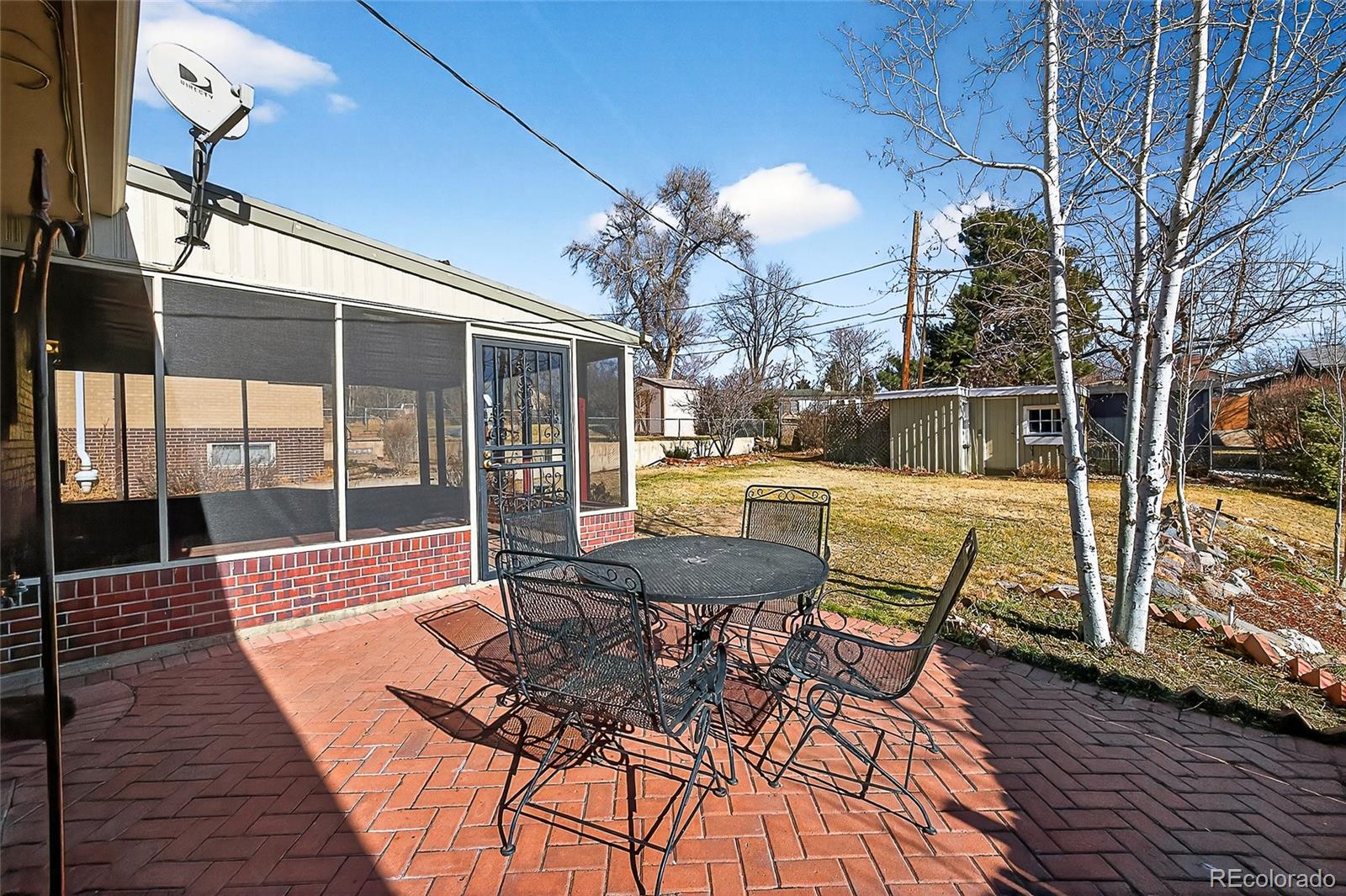 2768 South Mabry Way Denver, CO 80236 - Photo 31 of 39 a view of a swimming pool with outdoor seating