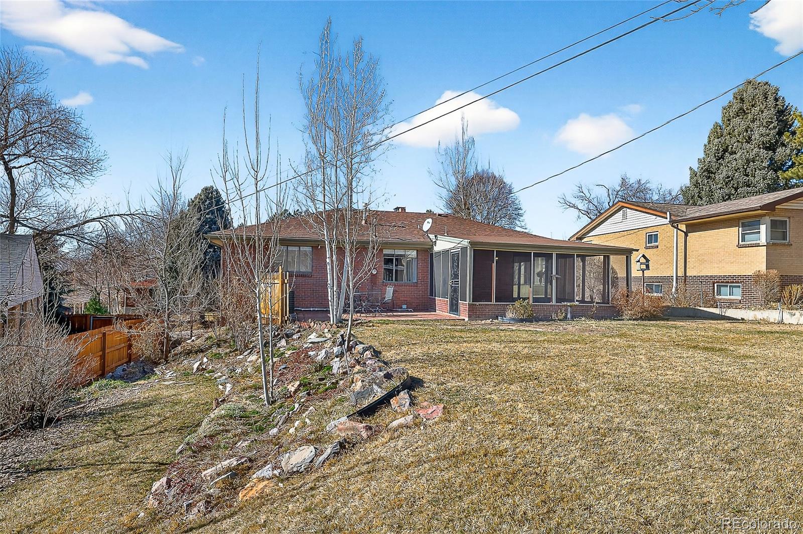 2768 South Mabry Way Denver, CO 80236 - Photo 33 of 39 a front view of a house with a yard