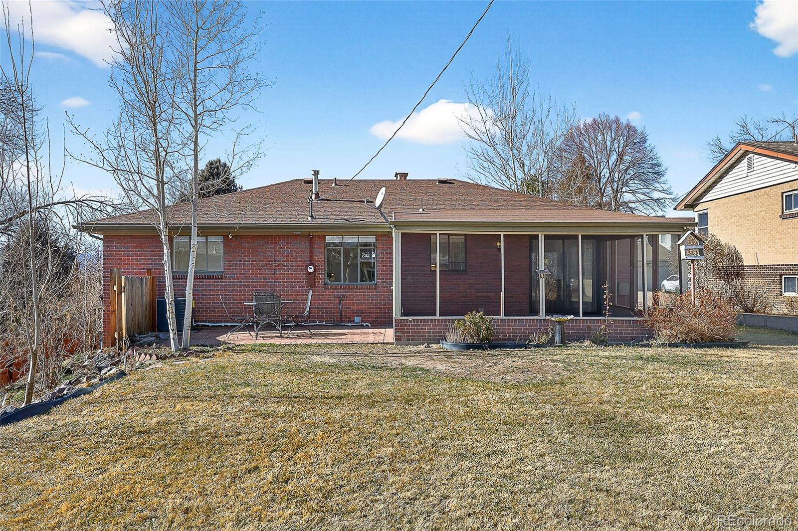 2768 South Mabry Way Denver, CO 80236 - Photo 34 of 39 a front view of a house with yard and seating space