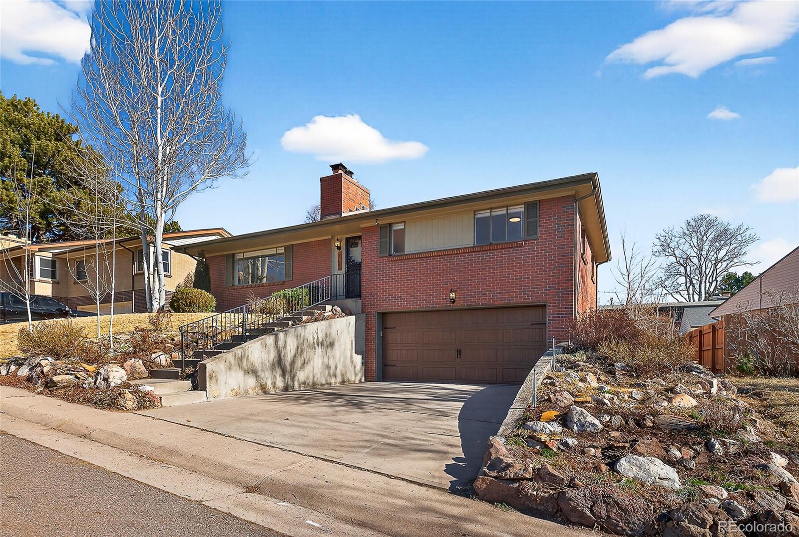 2768 South Mabry Way Denver, CO 80236 - Photo 39 of 39 a front view of a house with a yard