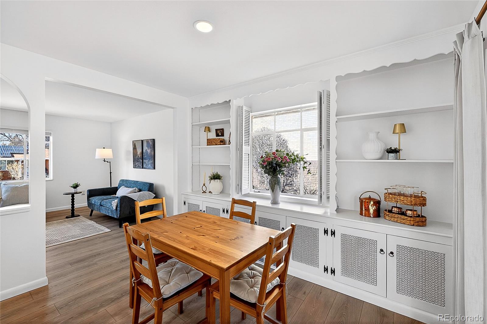 2768 South Mabry Way Denver, CO 80236 - Photo 8 of 39 a dining room with a table and chairs in it