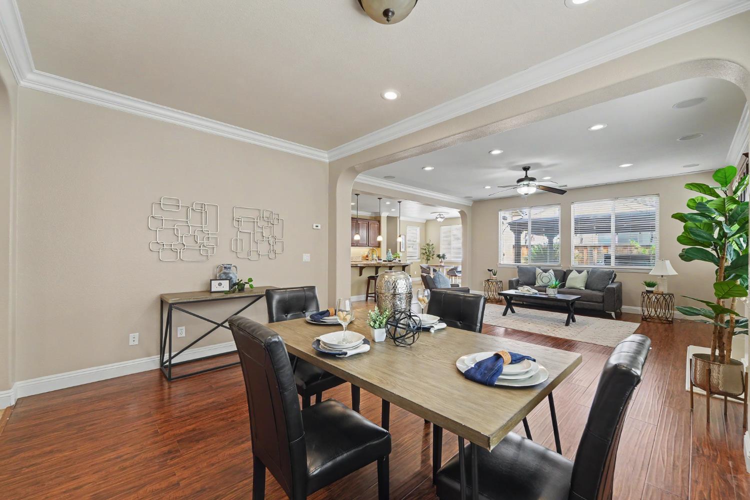 1223 East Springer Drive Turlock, CA 95382 - Photo 7 of 48 a view of a dining room with furniture and wooden floor