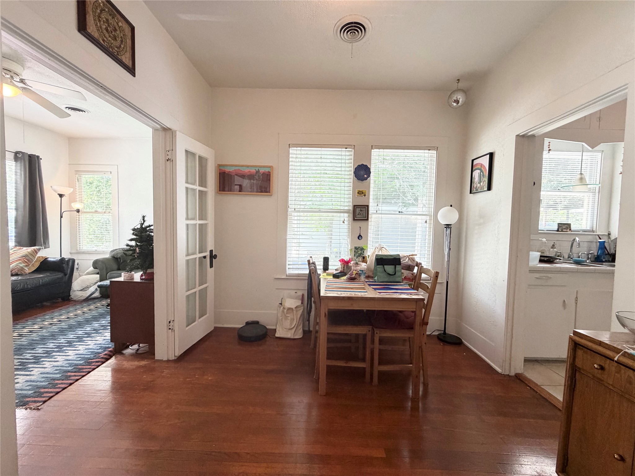 404 West 43rd Street, Unit A Austin, TX 78751 - Photo 3 of 10 a view of a dining room with furniture window and wooden floor