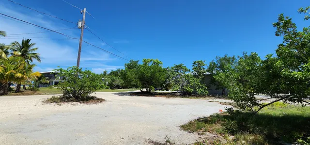 a view of a road with a building in the background