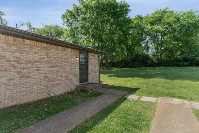 a view of backyard with green space