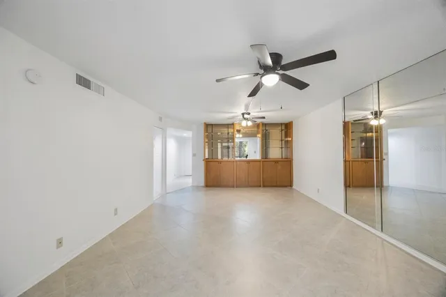 a view of a kitchen with a sink and a cabinet