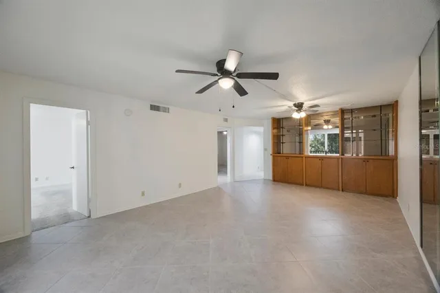a view of a kitchen with a sink and a refrigerator