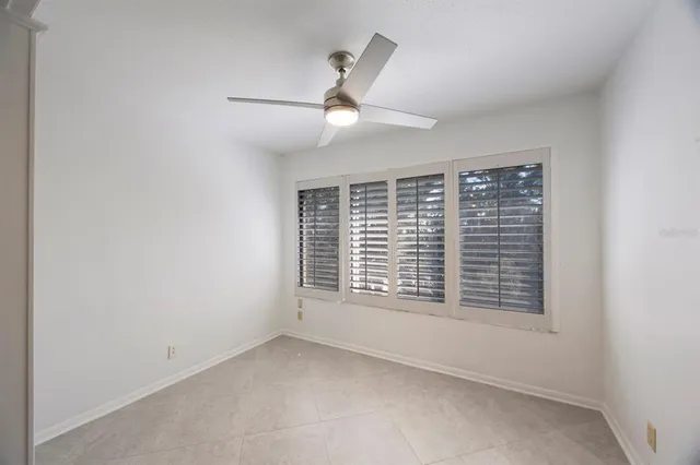 an empty room with a empty space and windows