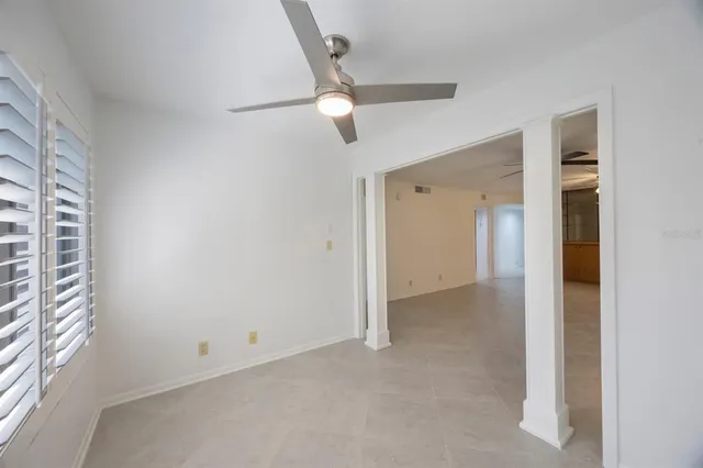 a view of an empty room with a closet