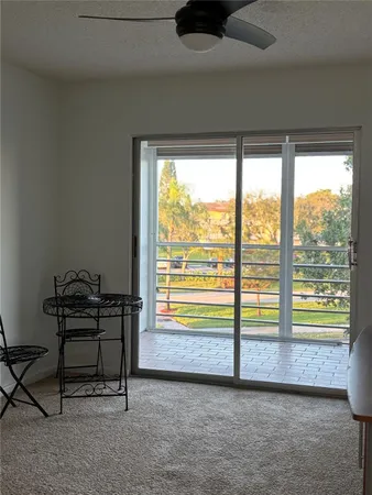 a view of a room with a floor to ceiling window
