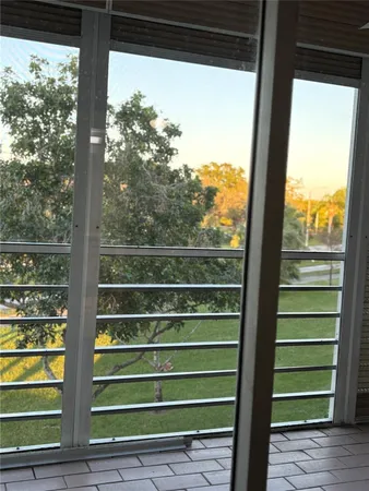 a view of a room with a large window