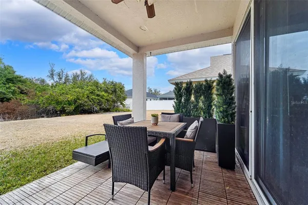 a balcony view with a seating space